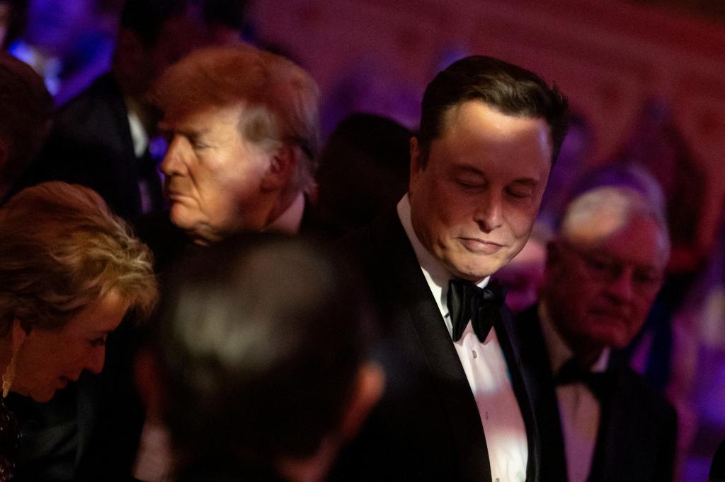 President-elect Donald Trump walks by Elon Musk during the America First Policy Institute (AFPI) gala at Mar-A-Lago in Palm Beach, Florida, U.S., November 14, 2024.