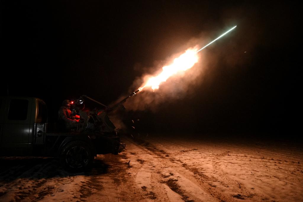 A Ukrainian serviceman from an anti-drone mobile air defence unit fires