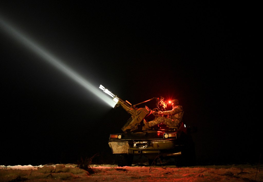 A Ukrainian serviceman from an anti-drone mobile air defence unit operates a ZU-23-2 anti-aircraft cannon