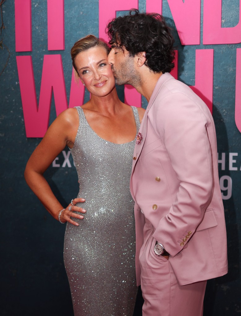 Justin Baldoni kisses his wife Emily Baldoni as they attend the New York premiere of "It Ends With Us" at at AMC Lincoln Square in New York, August 6, 2024.