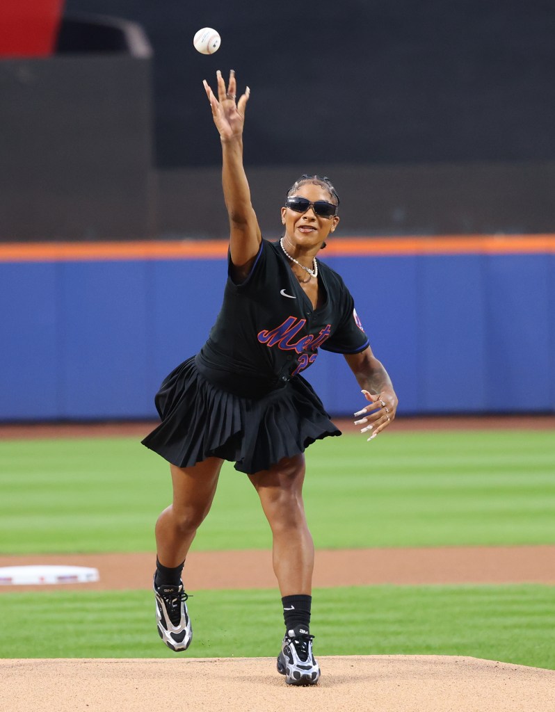 Jordan Chiles throwing out the ceremonial 1st pitch to Tyrone Taylor #15 of the New York Mets before a game against the Cincinnati Reds at Citi Field on September 6, 2024. 