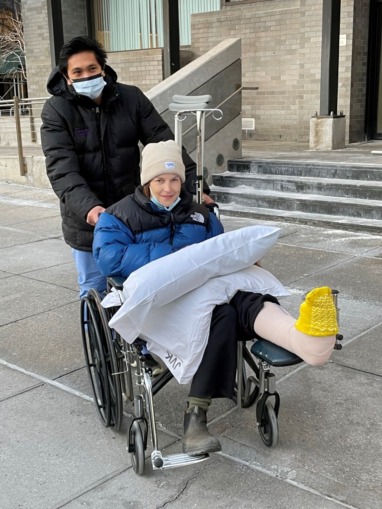 Wawrzyniak in a wheelchair, her leg in a cast