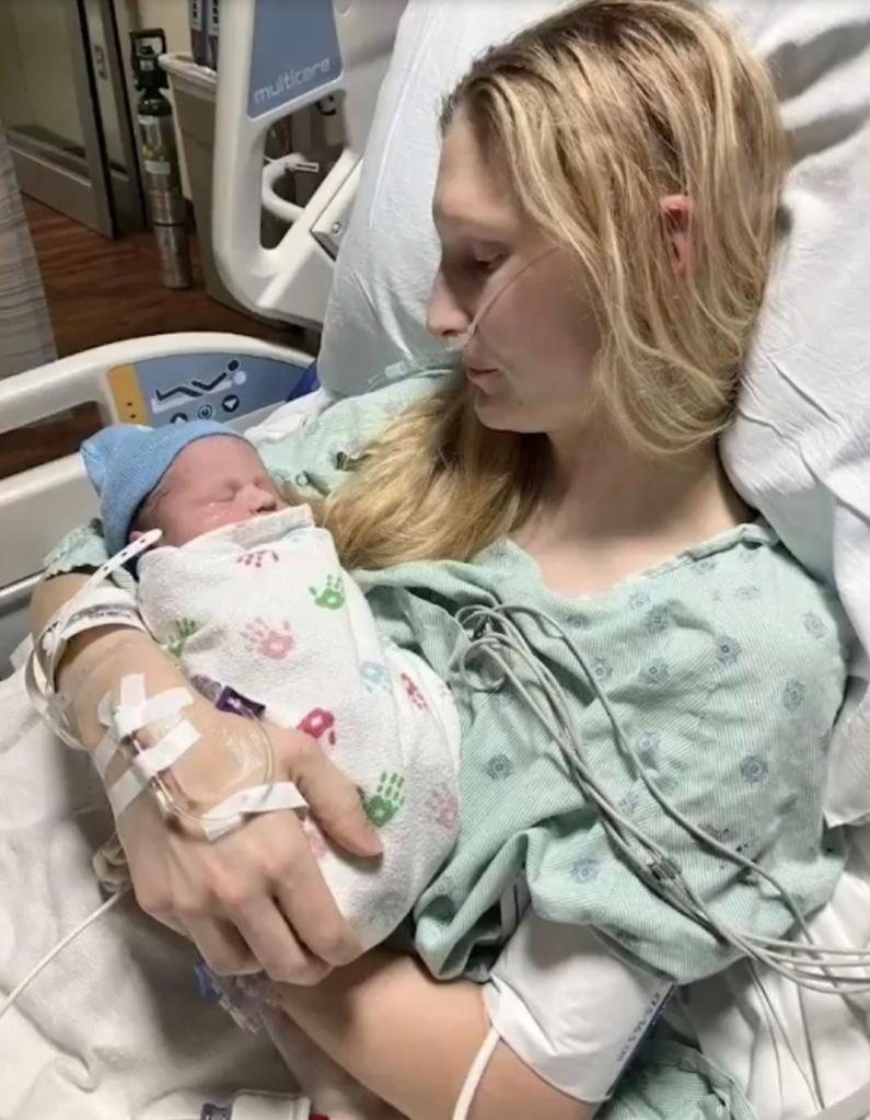 Young Chicago mother expressing gratitude to her medical team, with her baby