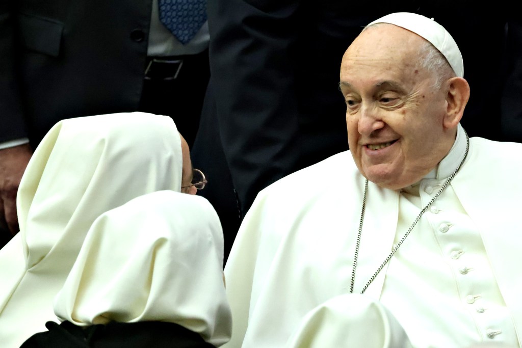 Pope Francis greets nuns during his