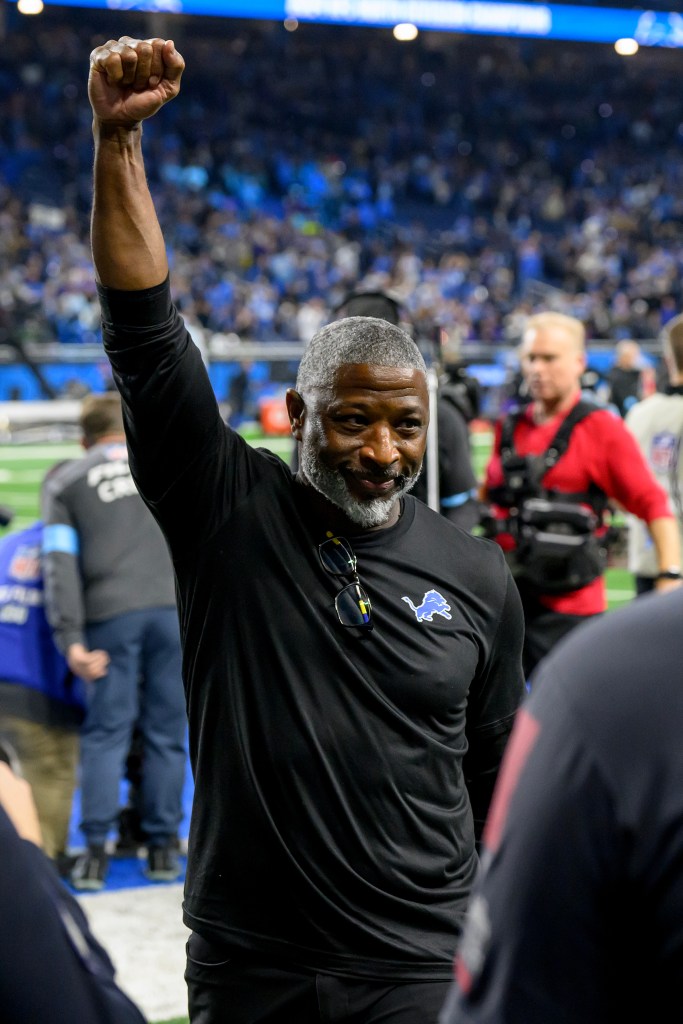 Detroit Lions defensive coordinator Aaron Glenn celebrates as he walks off the field following the Lions win over the Minnesota Vikings at Ford Field. 