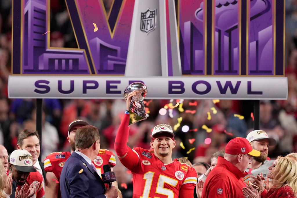 Kansas City Chiefs quarterback Patrick Mahomes (15) holds up the Vince Lombardi Trophy as he celebrates after defeating the San Francisco 49ers in the NFL Super Bowl 58 football game Sunday, Feb. 11, 2024, in Las Vegas. The Chiefs defeated the 49ers 25-22 in overtime.