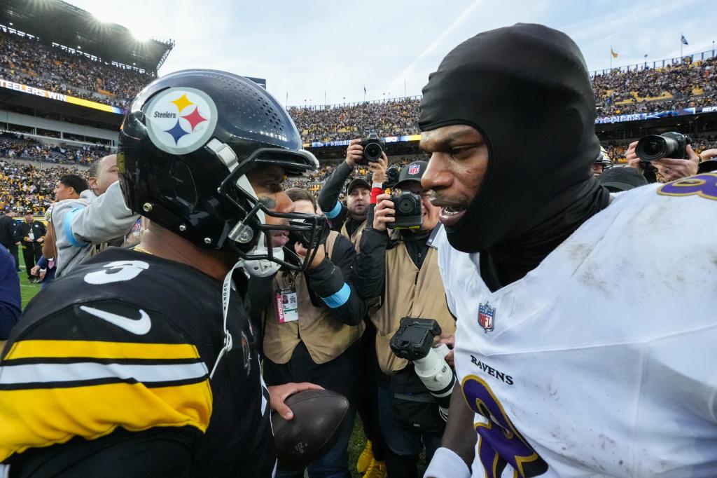 Pittsburgh Steelers quarterback Russell Wilson, left, talks with Baltimore Ravens quarterback Lamar Jackson following an NFL football game, Sunday, Nov. 17, 2024, in Pittsburgh. The Steelers won 18-16. 