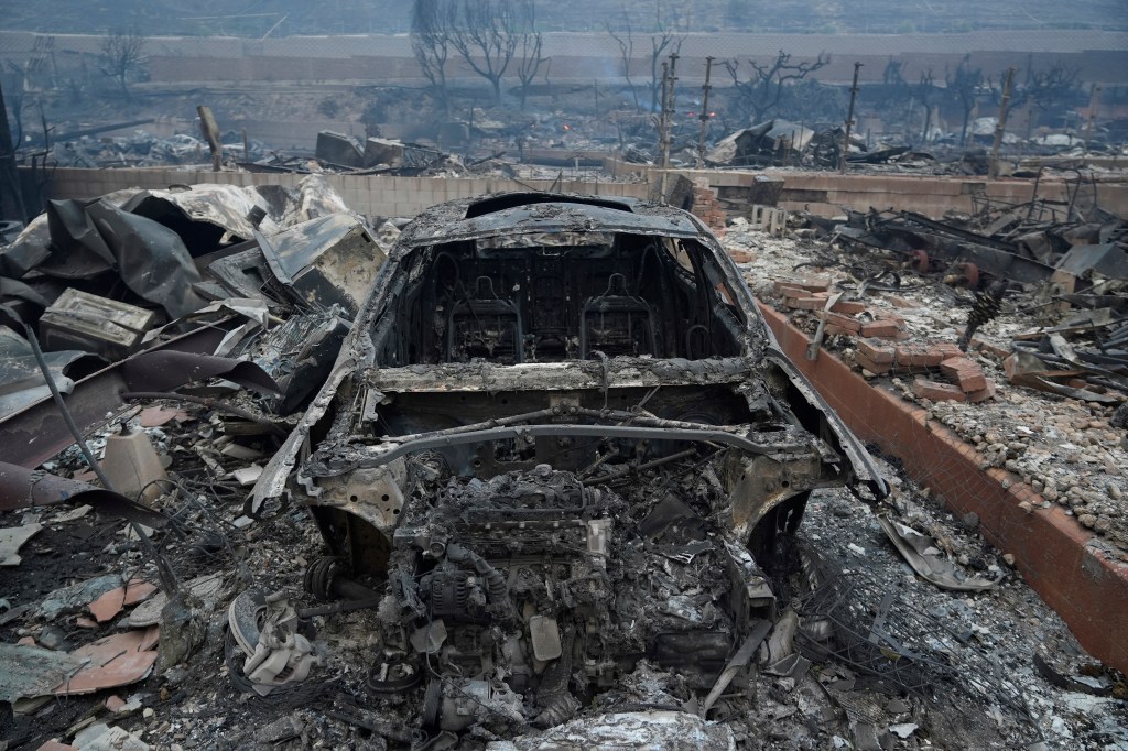 A burned out car in the Pacific Palisades neighborhood.