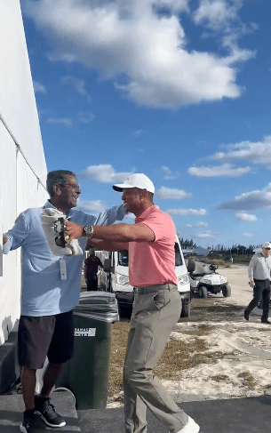 Woods embraces DiMeglio at the Hero World Challenge in December. Less than a month later, the legendary writer passed away in his home in Florida.