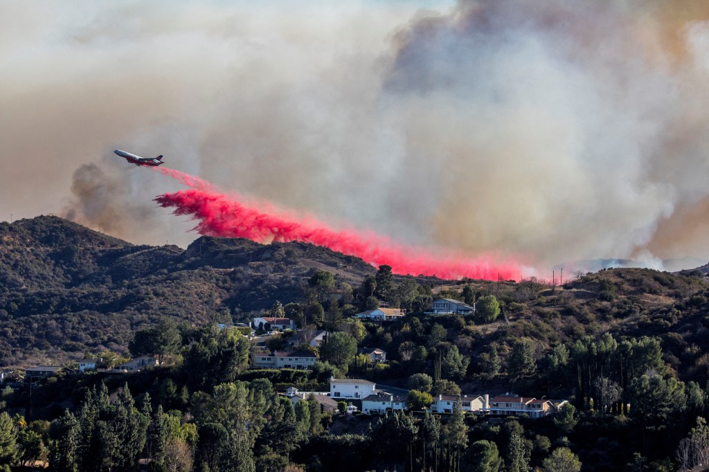 An air tanker drops fire retardant at the Palisades Fire