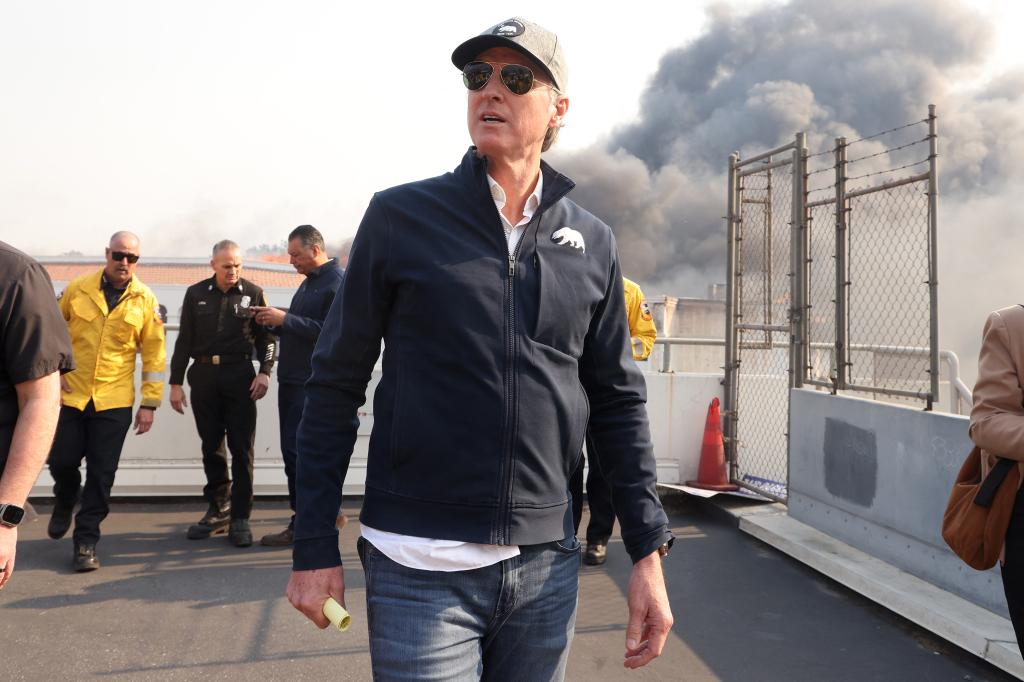 California Governor Gavin Newsom tours Pacific Palisades during the second day of the Palisades fire, which has burned more than 15,000 acres and destroyed at least 1,000 structures. 