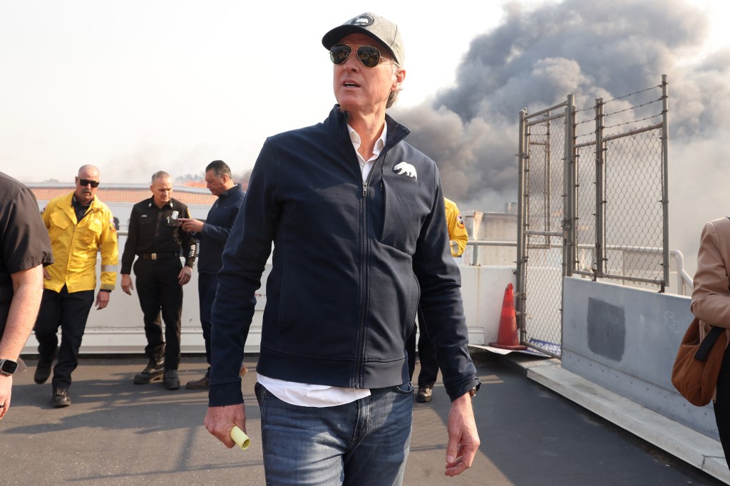 California Governor Gavin Newsom tours Pacific Palisades during the second day of the Palisades fire, which has burned more than 15,000 acres and destroyed at least 1,000 structures. 