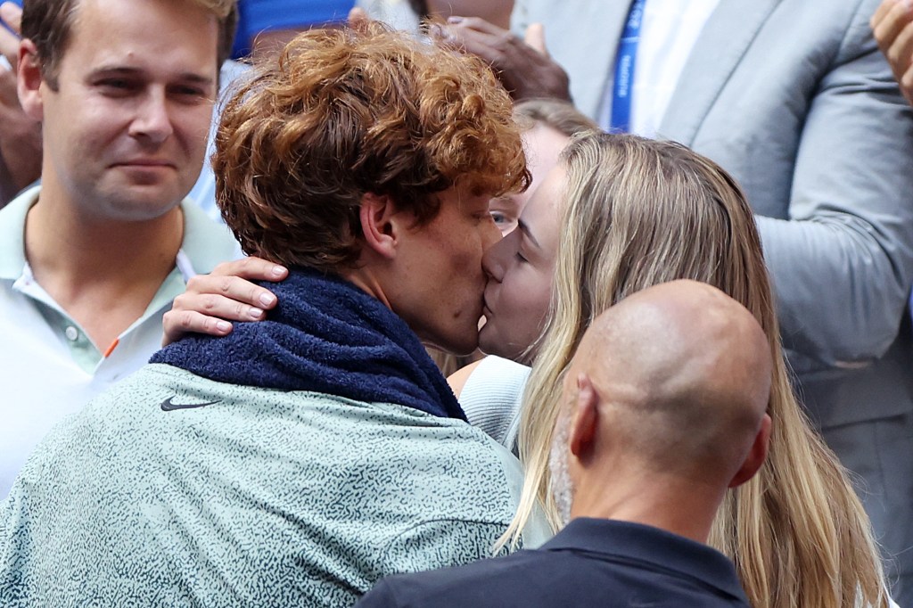 Jannik Sinner of Italy embracing and celebrating with his girlfriend Anna Kalinskaya after winning the Men's Singles Final at the 2024 US Open.