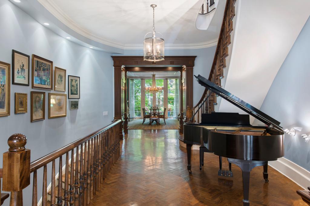 Purchased for $5 million in 2005 from the estate of a portrait artist known for painting figures like President Nixon and the Shah of Iran, the property was transformed from two duplexes into a single-family home with a two-story addition