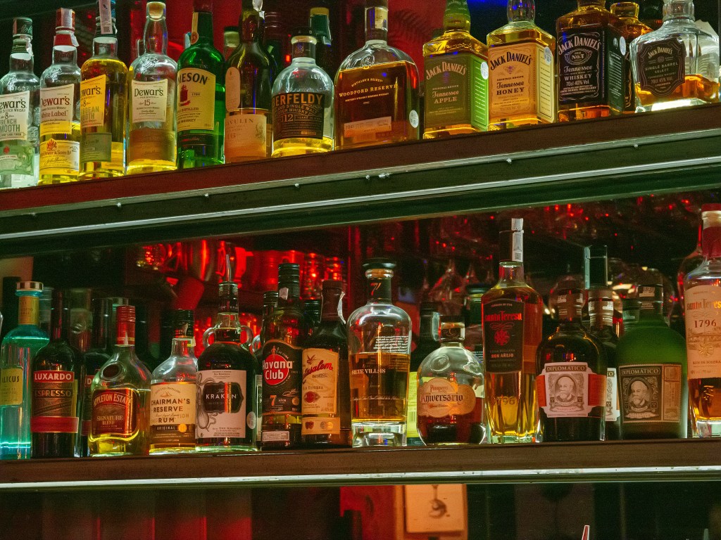 Bottles of spirits on a shelf at a bar