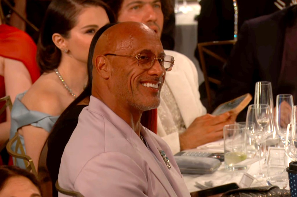 Dwayne Johnson laughing at Vin Diesel at the 2025 Golden Globes.