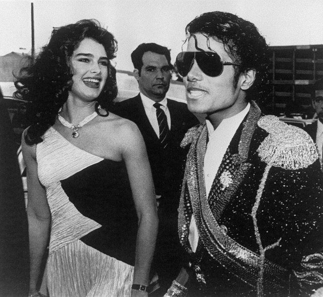 (FILES) US pop star and entertainer Michael Jackson (R) and actress Brooke Shields arrive at the shrine Auditorium in Los Angeles where Jackson is expected to run away with a major part of the Grammy awards on Febuary 28, 1984. Michael Jackson died on June 25, 2009 after suffering a cardiac arrest, sending shockwaves sweeping across the world and tributes pouring in on June 26 for the tortured music icon revered as the "King of Pop." AFP PHOTO/Alan ZANGER (Photo credit should read BERTRAND GUAY/AFP/Getty Images)