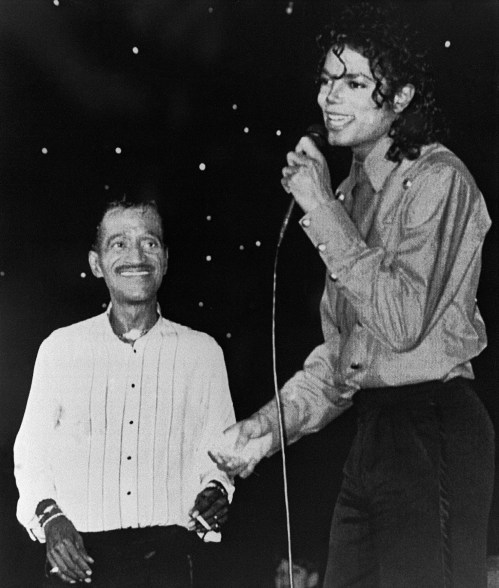 (FILES) US pop star and entertainer Michael Jackson performs with Sammy Davis Junior August 14, 1988 in Monaco. Michael Jackson died on June 25, 2009 after suffering a cardiac arrest, sending shockwaves sweeping across the world and tributes pouring in on June 26 for the tortured music icon revered as the "King of Pop." AFP PHOTO/POOL/ (Photo credit should read -/AFP/Getty Images)