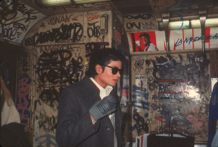 Popular American musician Michael Jackson (1958 - 2009) stands in a graffiti-filled subway car during the filming of the long-form music video for his song 'Bad,' directed by Martin Scorsese, New York, New York, November 1986. (Photo by Hulton Archive/Getty Images)