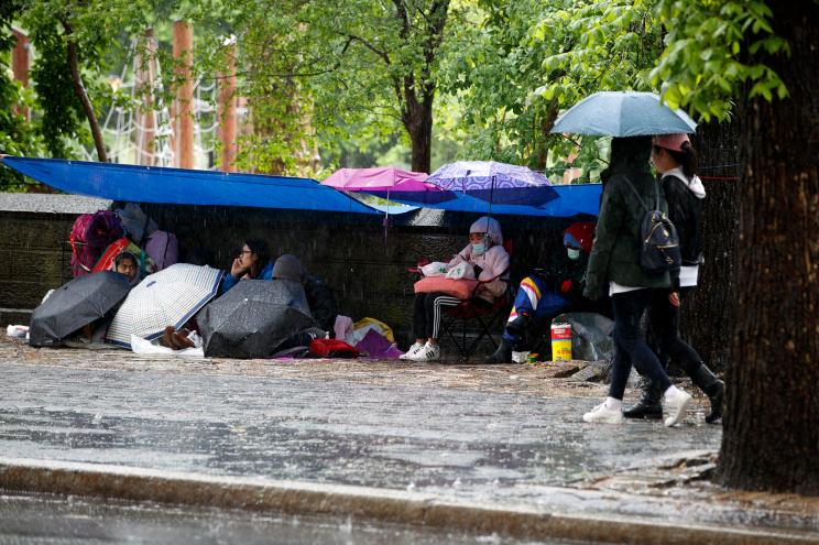 Fans camp out outside of Central Park ahead of BTS's free concert inside the park