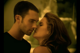 Adam Levine and Kelly Preston kiss in a music video for Maroon 5's "She Will Be Loved."