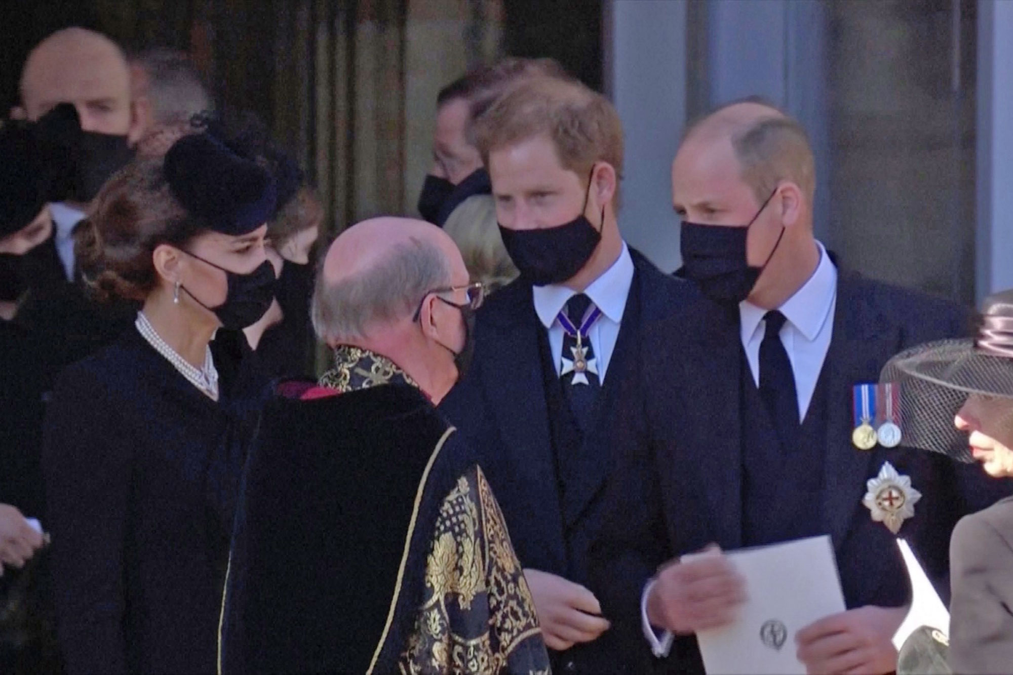 Kate Middleton with Prince Harry and Prince William at the funeral for Prince Philip in April 2021.