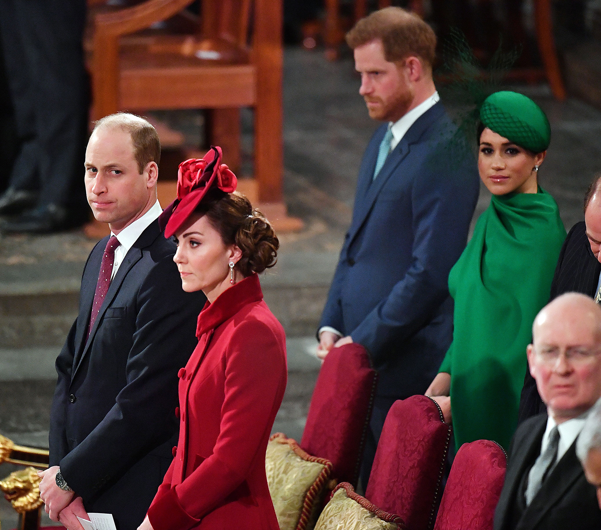 Prince William and Kate Middleton sit in front of Prince Harry and Meghan Markle at Commonwealth Day services in March 2002.