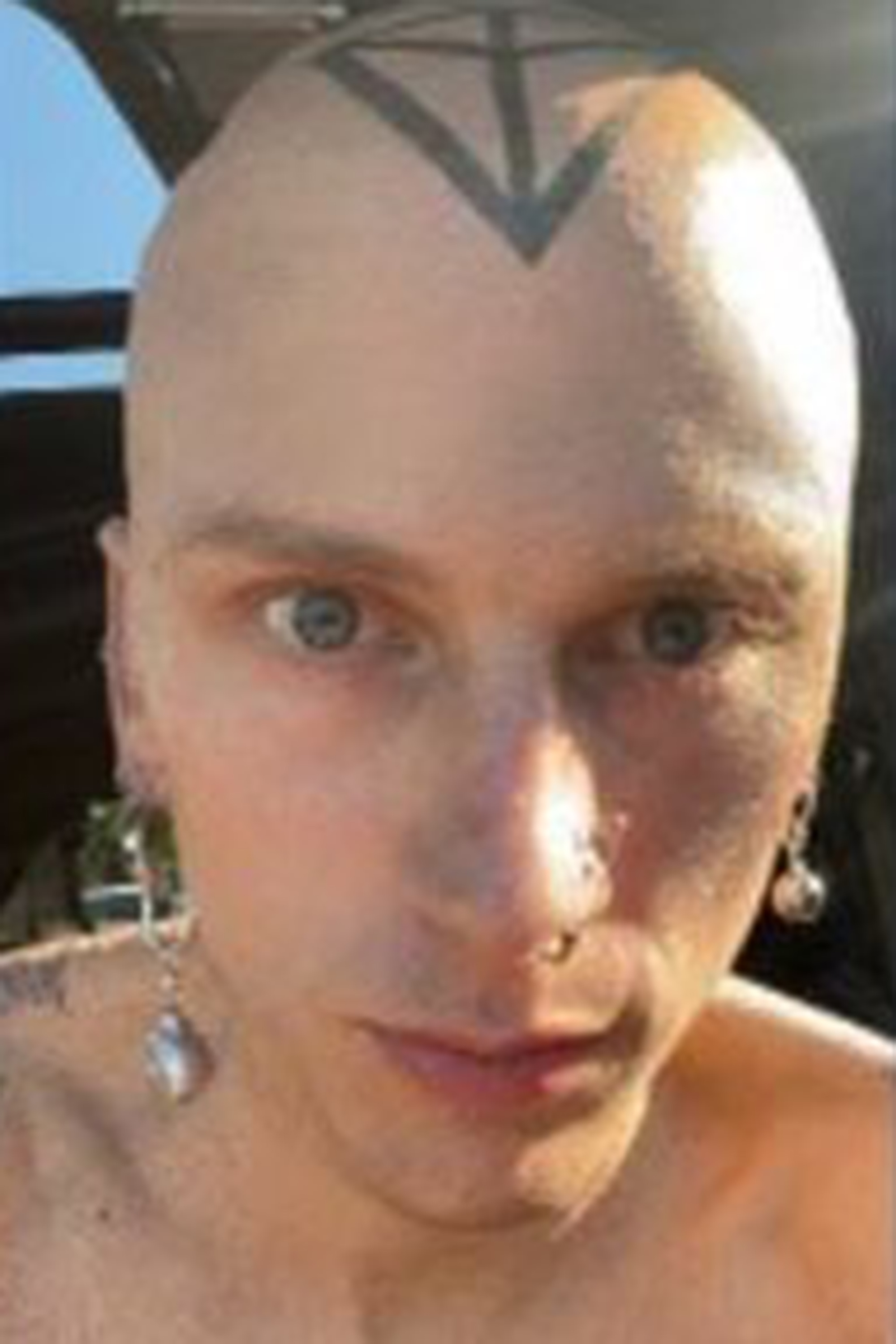 Machine Gun Kelly shows off bald head and skull tattoo