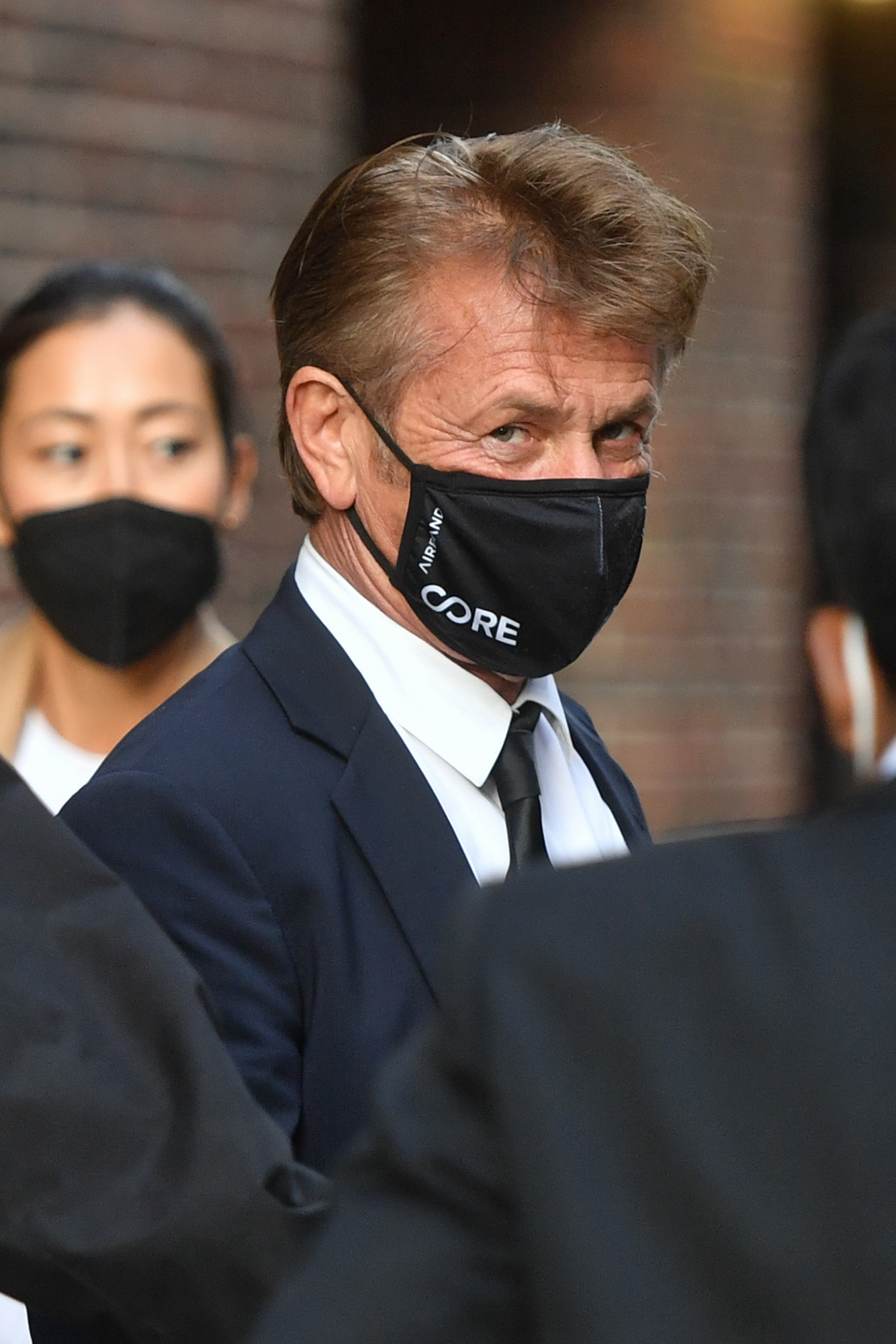 Sean Penn wearing a mask.