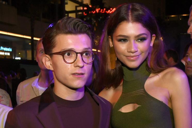 Tom Holland and Zendaya stand together at the "Spider-Man: Far From Home" premiere party in 2019.