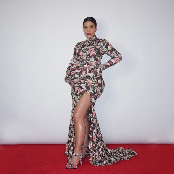 Kim Kardashian on Halloween 2015, dressed as herself at the 2013 Met Gala red carpet