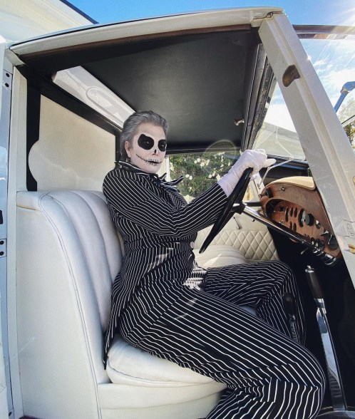 Kris Jenner dressed as Jack Skellington, driving a car