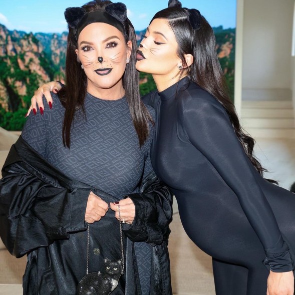 Kylie and Kris Jenner dressed in black catsuits