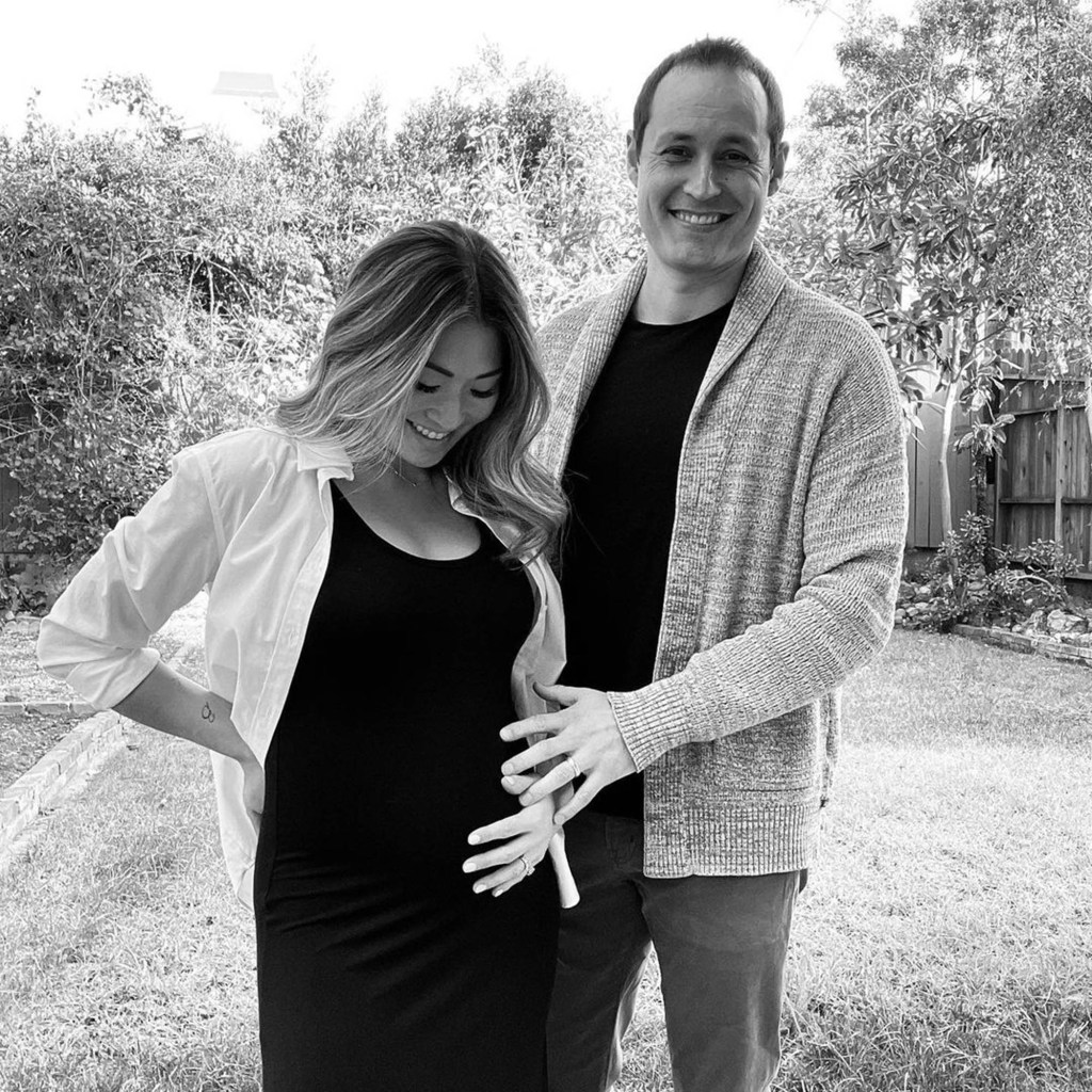 Jenna Ushkowitz's husband, David Stanley, cradling her baby bump