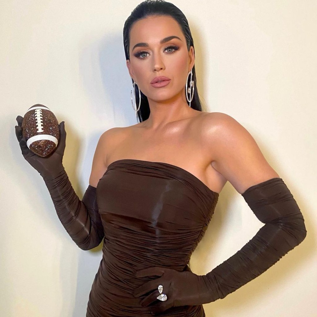 Katy Perry carrying a football-shaped purse