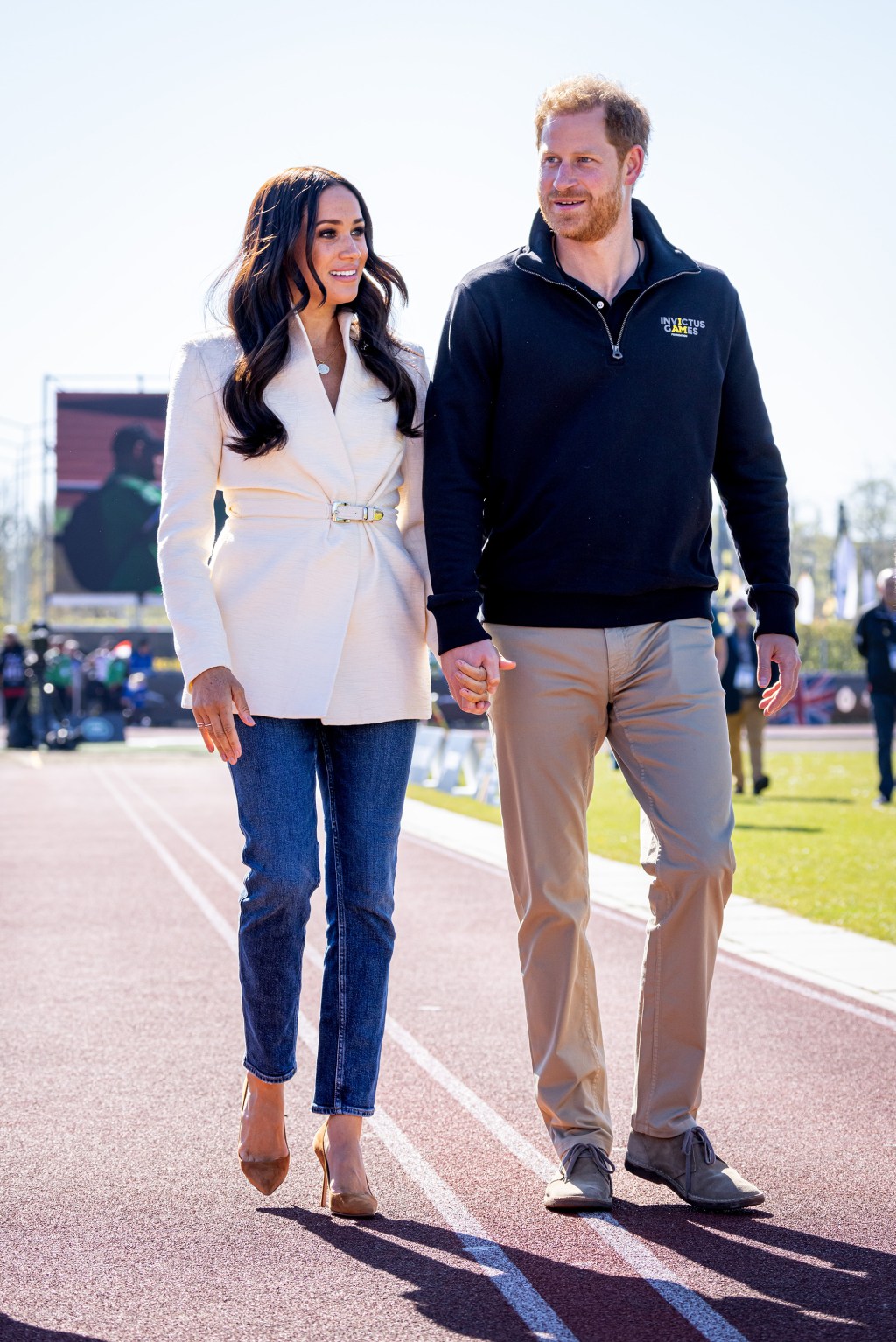 Prince Harry and Meghan Markle holding hands in April. 