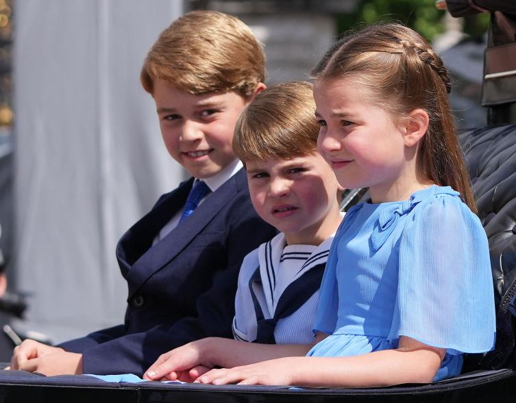 Prince George, Princess Charlotte and Prince Louis sitting in a carriage at Trooping the Colour.