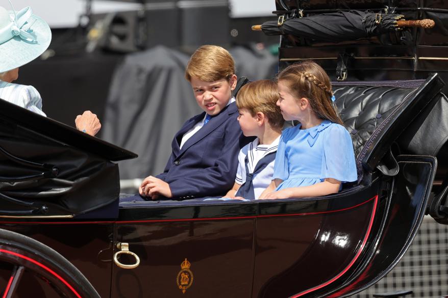 Prince George, Princess Charlotte and Prince Louis sitting in a carriage at Trooping the Colour.