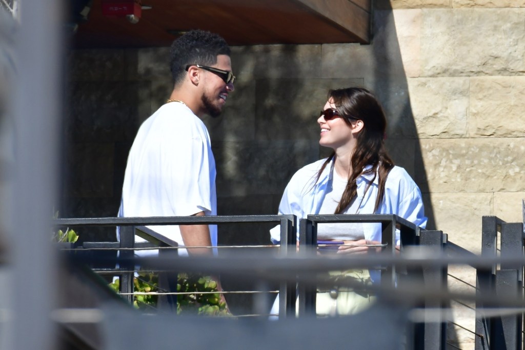 Devin Booker and Kendall Jenner staring at each other while smiling at Soho House in Malibu