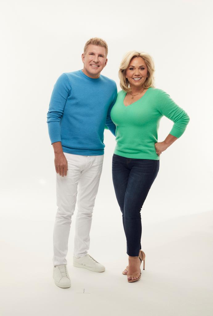 Todd Chrisley and Julie Chrisley posing for a photo.