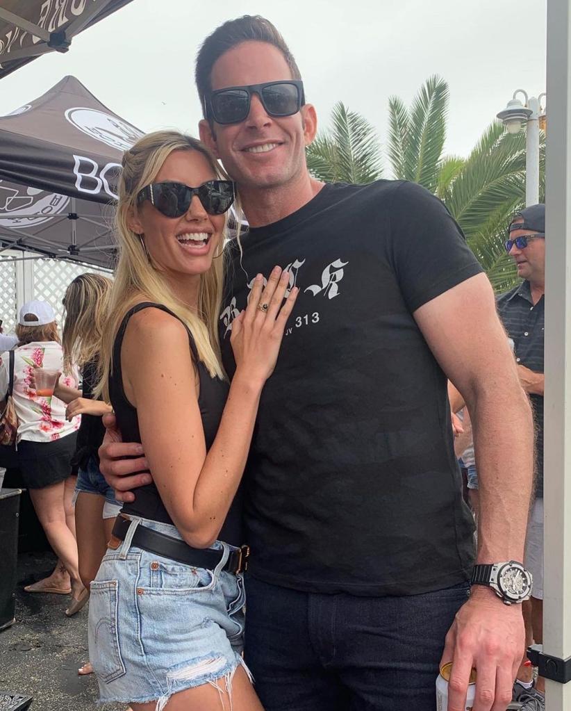 Tarek El Moussa and Heather Rae Young posing together.