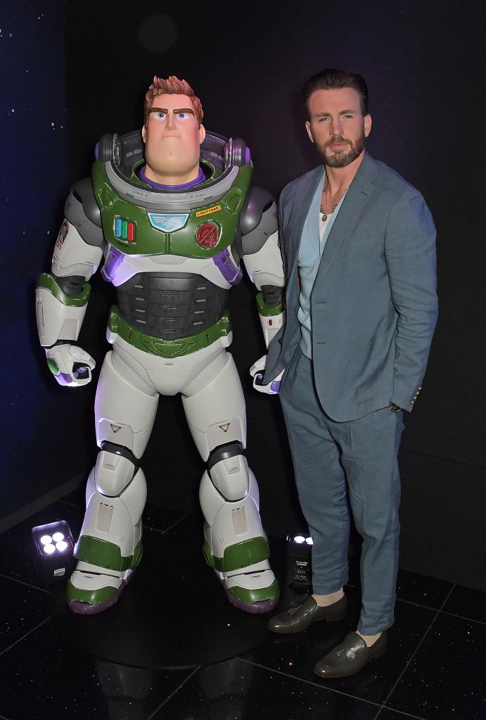 Chris Evans posing with Buzz Lightyear.