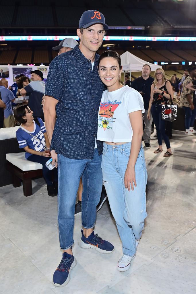 Ashton Kutcher and Mila Kunis at a charity event.