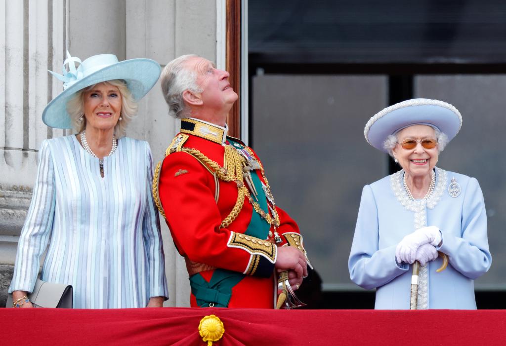 Camilla, Duchess of Cornwall, Prince Charles, Prince of Wales, and Queen Elizabeth II standing