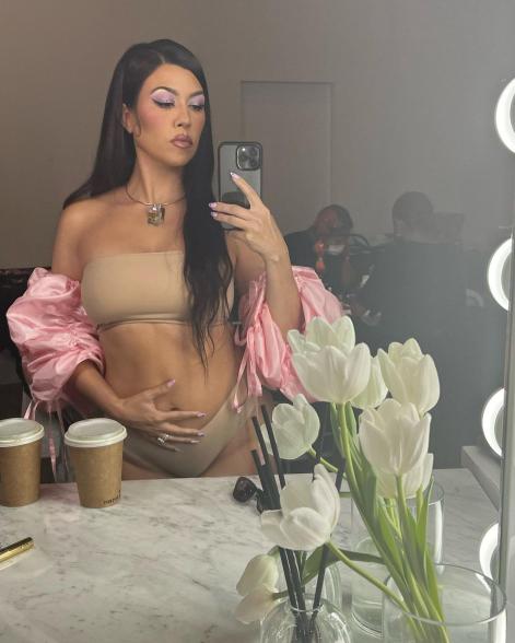 Kourtney Kardashian in nude lingerie.