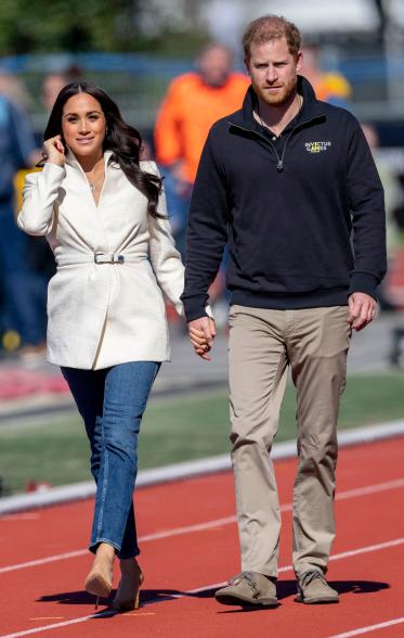 Meghan Markle and Prince Harry walking.