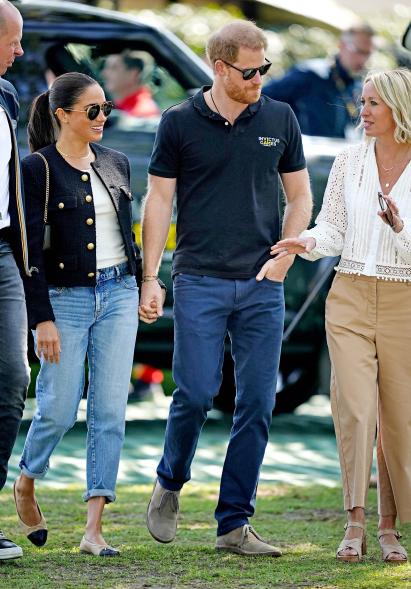 Meghan Markle and Prince Harry walking.