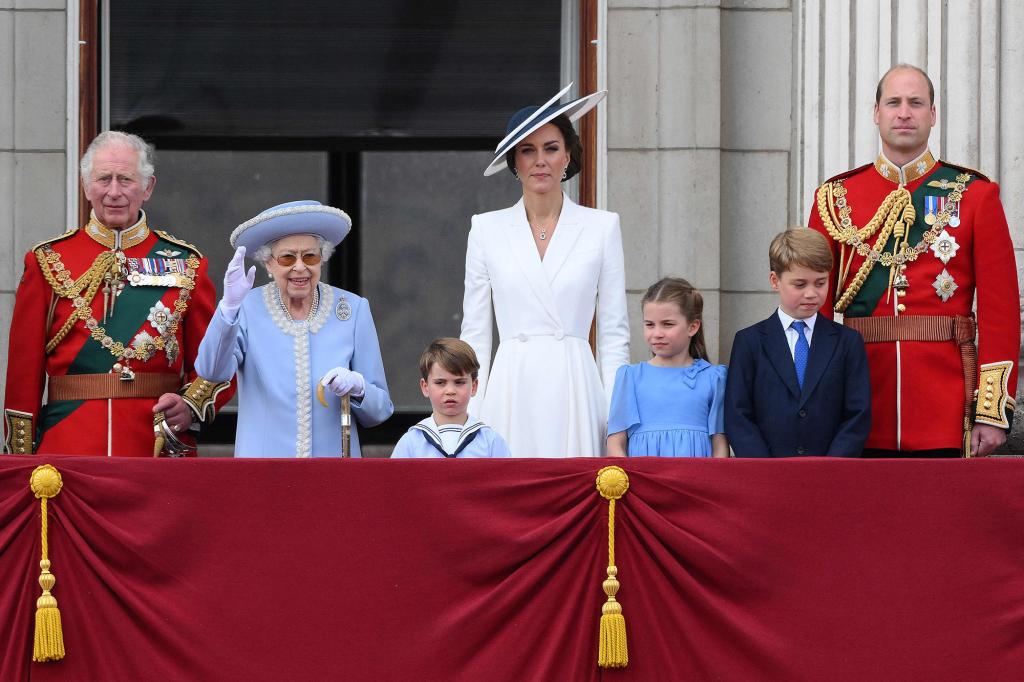 Prince Charles, Queen Elizabeth II, Kate Middleton, Prince Louis, Princess Charlotte, Prince George and Prince William standing on the balcony of Buckingham Palace.