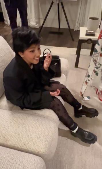 A photo of North West dressed as Kris Jenner.