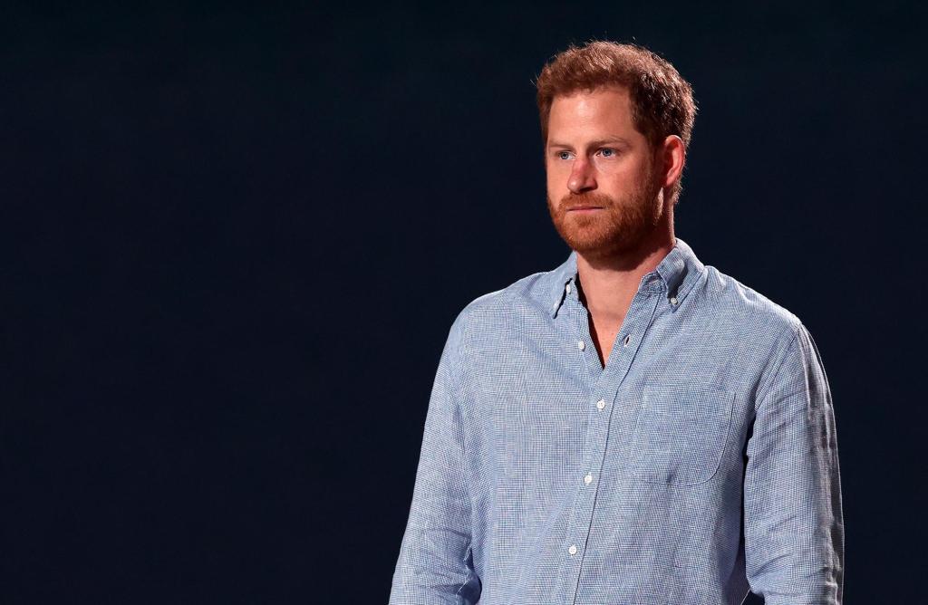 Prince Harry speaking on a stage.